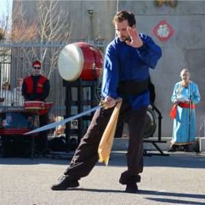 Nate performing a saber form at Chinese New Year